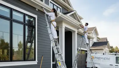 Professional trim and fascia painting on Houston TX home exterior by expert house painters